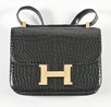 Lot 2 - An Hermès black crocodile Constance bag, circa...