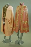Lot 162 - A felted wool and lace inset evening cape...