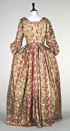 Lot 134 - A brocaded satin open robe the fabric late...