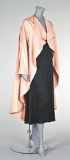 Lot 177 - A Balenciaga peach silk faille evening coat,...
