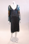 Lot 154 - A black tulle flapper dress and matching...