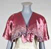 Lot 164 - A Schiaparelli mauve satin bolero and...