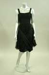 Lot 166 - A Jean Desses black draped chiffon cocktail...