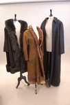 Lot 235 - An Yves Saint Laurent brown suede coat,...