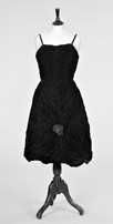 Lot 66 - A black velvet cocktail gown attributed to...