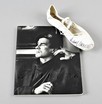 Lot 206 - A white ballet pump autographed by Rudolf...