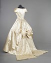 Lot 59 - A Norman Hartnell bridal gown, circa 1957, of...