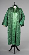 Lot 67 - A green cloqusatin evening coat, attributed to...