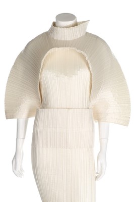 Lot 306 - An Issey Miyake ivory polyester dress with...