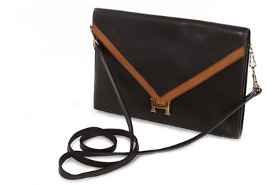 Lot 30 - An Hermès Lydie brown box leather clutch bag,...