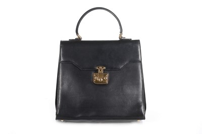 Lot 76 - A Gucci black leather handbag, probably 1980s,...