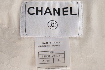 Lot 1 - A Chanel white silk tweed suit, 2002, labelled...