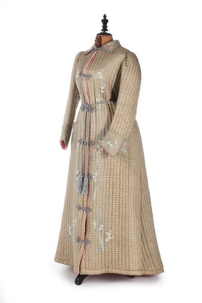 Lot 405 - A quilted and embroidered silk housecoat, 1875-...