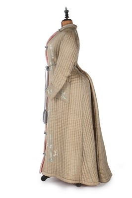 Lot 405 - A quilted and embroidered silk housecoat, 1875-...