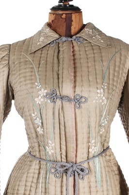 Lot 405 - A quilted and embroidered silk housecoat, 1875-...