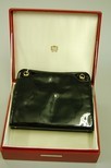 Lot 29 - A Cartier Ltd, London black patent leather...