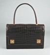 Lot 13 - .An Hermès dark brown crocodile `Piano'...