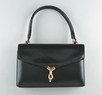 Lot 15 - An Hermès black leather handbag, circa 1960-70,...