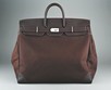 Lot 26 - An Hermès Haute a Carrois dark brown canvas...