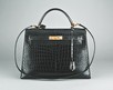 Lot 3 - An Hermès black crocodile Kelly bag, French,...