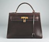 Lot 10 - An Hermès chocolate brown leather Kelly bag,...