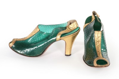 Lot 336 - A rare pair of perforated green plastic shoes,...