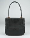 Lot 16 - An Asprey black crocodile handbag, circa 1970,...