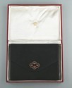 Lot 21 - A Cartier black suede pochette, circa 1930,...