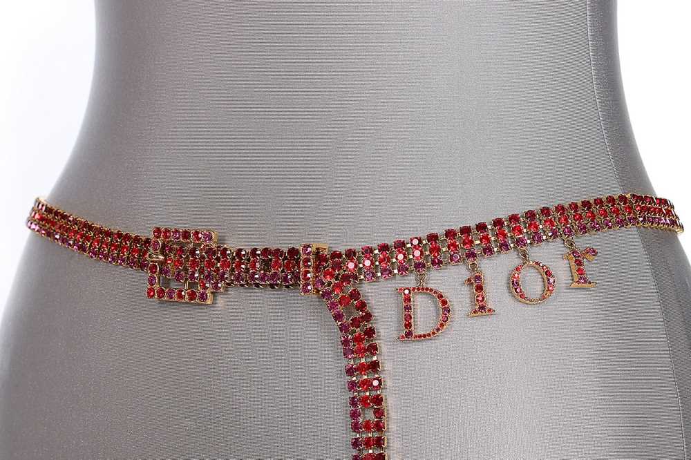 Lot 40 - A Dior rhinestone belt with dangling letter...