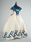Lot 61 - A cream challis ball gown circa 1863, the...