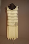 Lot 95 - A pale lemon beaded flapper dress french circa...
