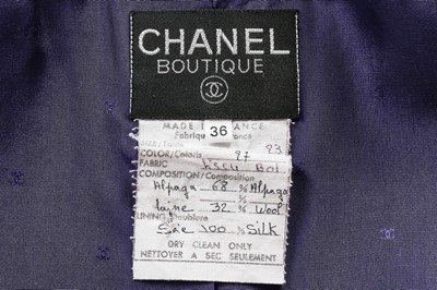 Lot 28 - A Chanel purple wool coat, early 1990s,...