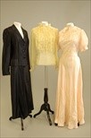 Lot 157 - A Norman Hartnell black satin evening suit,...
