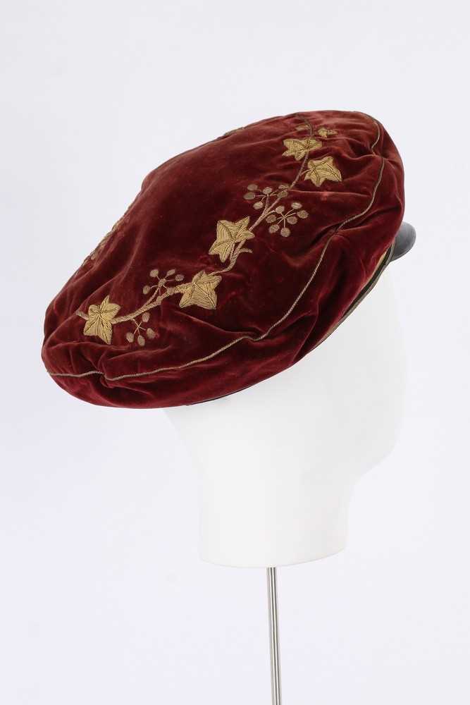 Lot 420 - An unusual young man's claret-red velvet cap,...