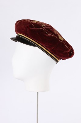 Lot 420 - An unusual young man's claret-red velvet cap,...