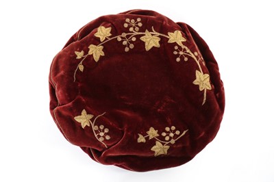 Lot 420 - An unusual young man's claret-red velvet cap,...