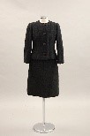 Lot 23 - A Givenchy black bouclwool suit, circa 1960,...