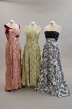 Lot 103 - Seven ball gowns and a full length velvet cape,...