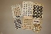Lot 211 - A general group of buttons and pins on shop...