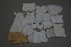 Lot 114 - Doll and baby clothes, lace trimmings, mainly...