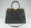 Lot 185 - A Christian Dior black crocodile handbag,...