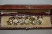 Lot 200 - A cased set of six sporting buttons buttons,...