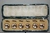 Lot 202 - Six cased hunt/race buttons, circa 1920, with...
