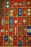 Lot 233 - A miscellaneous grouping of buttons in display...