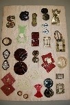 Lot 235 - A display board of assorted buckles, various...