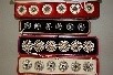Lot 244 - Three cased paste-inset buttons, various dates,...