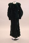 Lot 21 - A green velvet evening coat, early 1930s,...