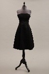 Lot 127 - A Givenchy black sillk faille cocktail gown,...