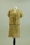 Lot 151 - A Jean Dessès camel tape-lace cocktail gown...