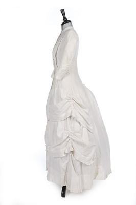 Lot 170 - A white cotton piqué summer gown, late 1880s,...